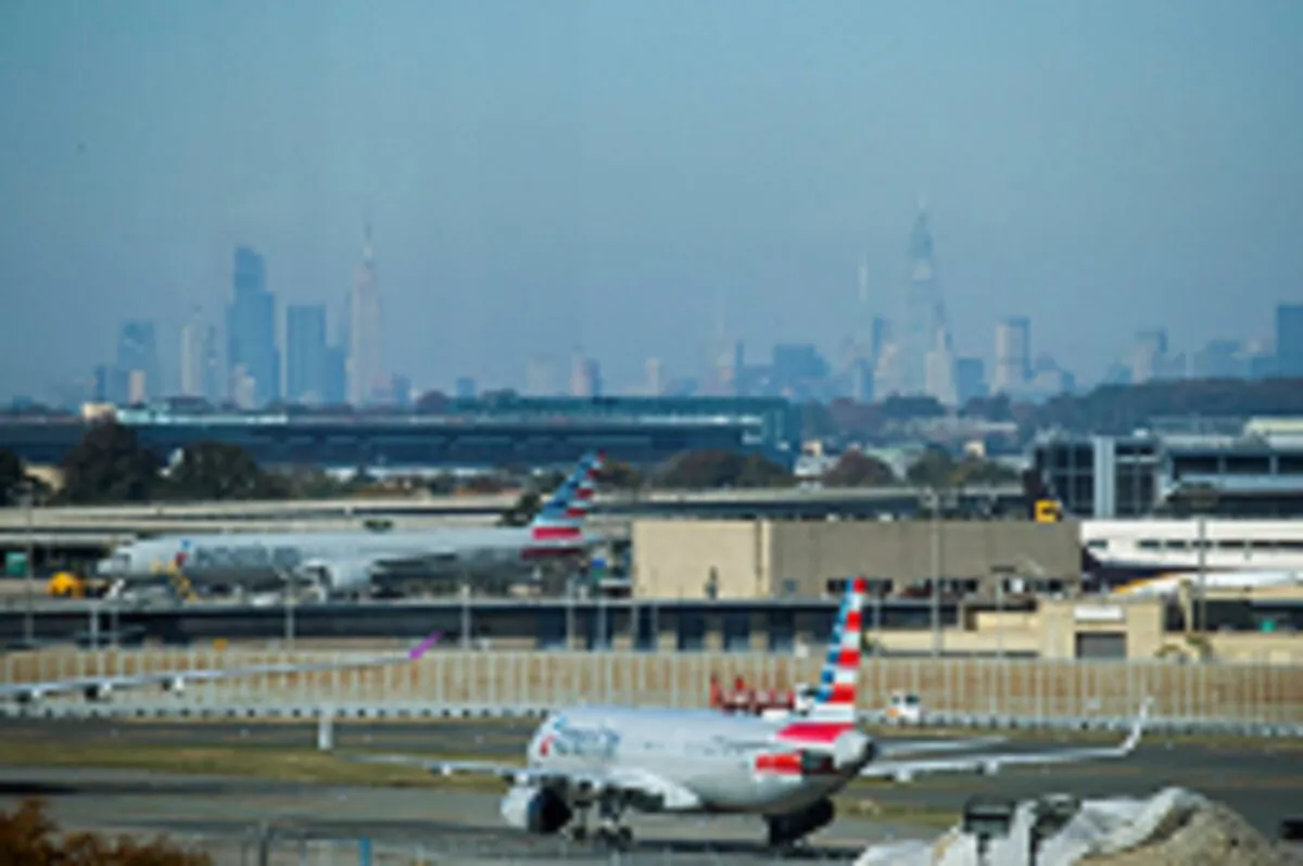 American Airlines planes taxi on the tarmac with the skyline of New York City in the background from the JFK International Airport in New York, on Nov. 8, 2021. (Eduardo Munoz/Reuters)