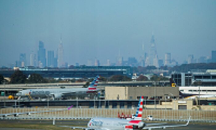 American Airlines planes taxi on the tarmac with the skyline of New York City in the background from the JFK International Airport in New York, on Nov. 8, 2021. (Eduardo Munoz/Reuters)