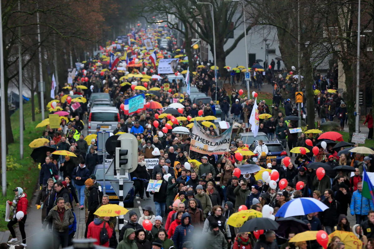 People protest against new measures to fight a record surge of coronavirus disease (COVID-19) infections, in Utrecht, Netherlands, on Dec. 4, 2021. (Eva Plevier/Reuters)
