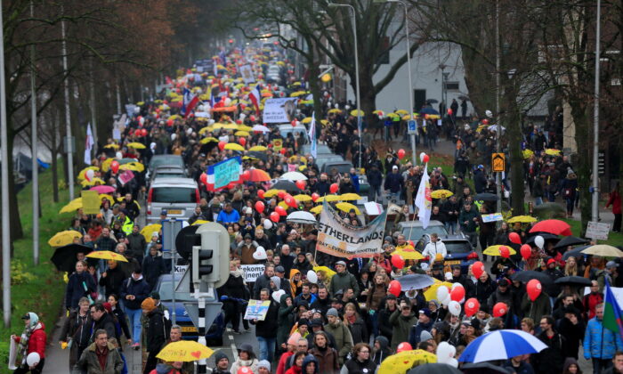 People protest against new measures to fight a record surge of coronavirus disease (COVID-19) infections, in Utrecht, Netherlands, on Dec. 4, 2021. (Eva Plevier/Reuters)