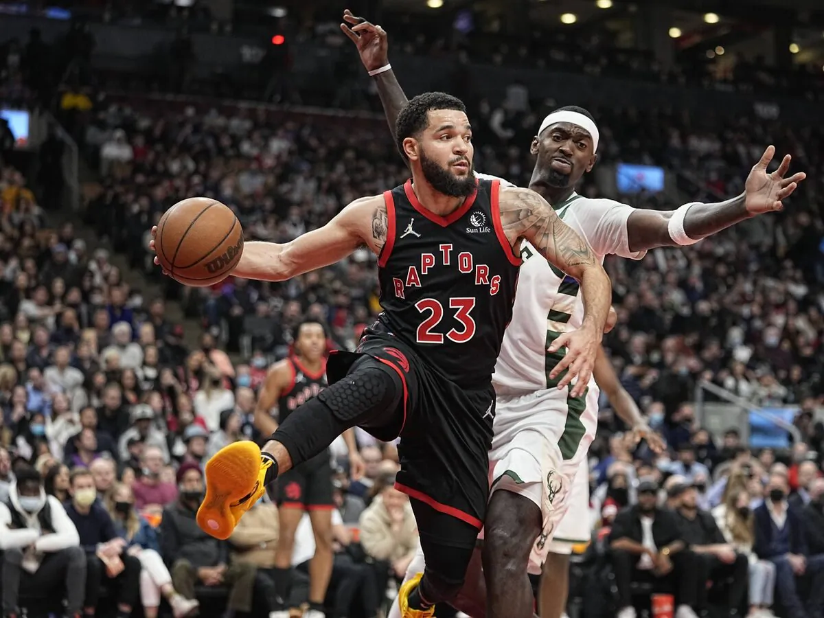 Toronto Raptors guard Fred VanVleet (23) passes the ball as Milwaukee Bucks center Bobby Portis (9) defends during the second quarter at Scotiabank Arena in Toronto on Dec. 2, 2021. (John E. Sokolowski/USA TODAY Sports via Field Level Media)