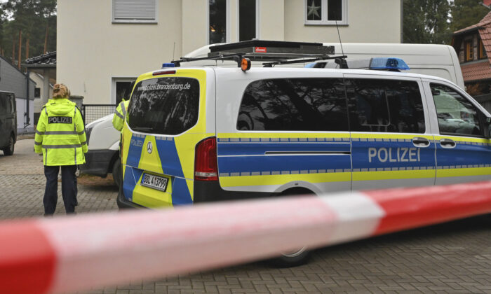 On December 4, 2021, police closed a detached house in Senzig, the district of the town of Königsvsterhausen in the Dahme-Spreewald district.  (Patrick Pleul / dpa via AP)