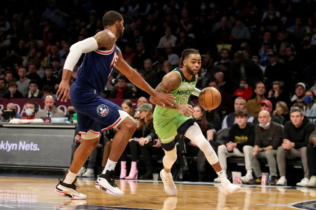 Minnesota Timberwolves guard D'Angelo Russell (0) drives to the basket against Brooklyn Nets center LaMarcus Aldridge (21) during an NBA game at Barclays Center in N.Y., on Dec. 3, 2021. (Brad Penner/USA TODAY Sports via Field Level Media)