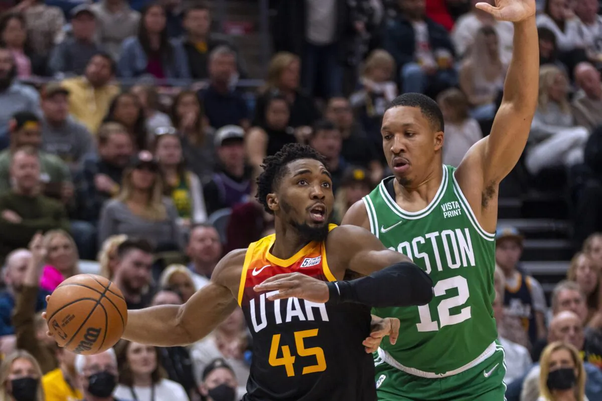 Utah Jazz guard Donovan Mitchell (45) drives against Boston Celtics forward Grant Williams (12) during an NBA game in Salt Lake City, on Dec. 3, 2021. (Rick Egan/AP Photo)