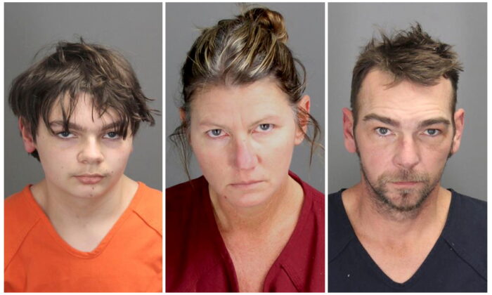 Ethan Robert Crumbley, 15, charged with first-degree murder in a high school shooting, poses in a jail booking photograph taken at the Oakland County Jail in Pontiac, Mich., on Dec. 1, 2021, in a combination photograph with his parents Jennifer Lynn Crumbley and James Robert Crumbley who were taken into custody Dec. 3, 2021. (Oakland County Sheriff's Office/Handout via Reuters)