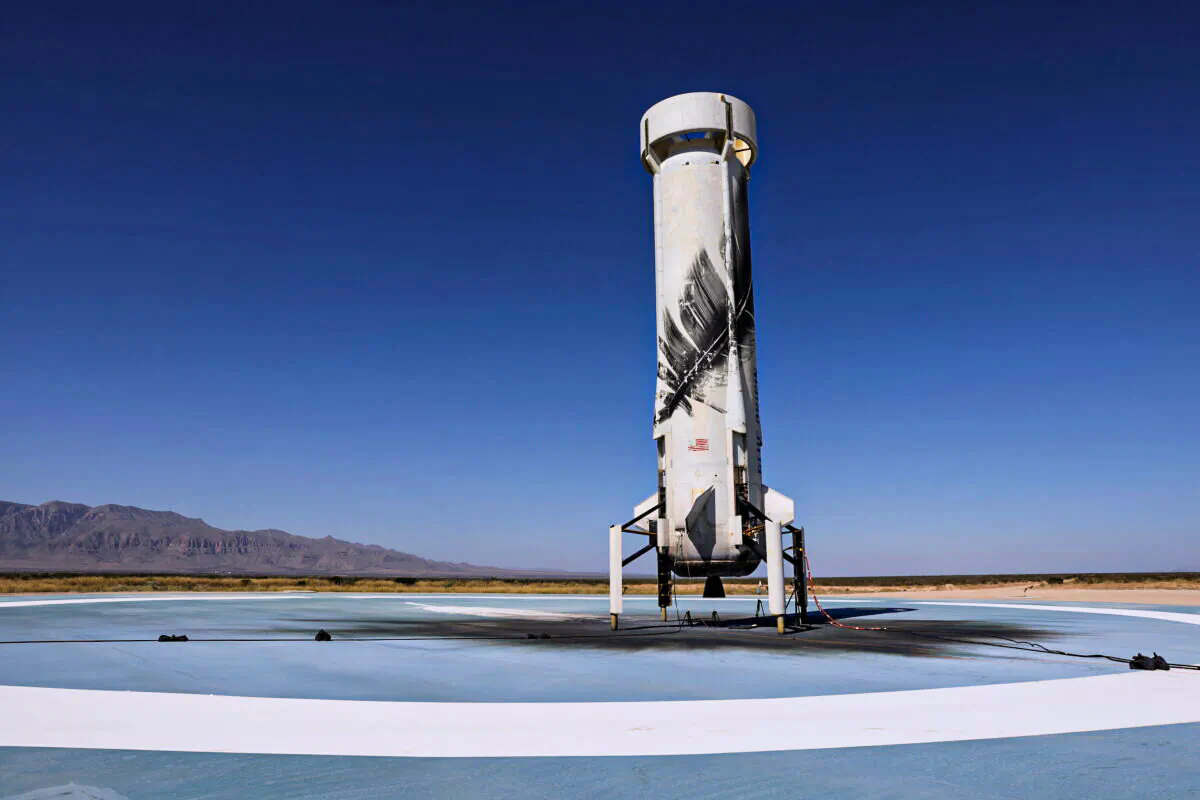 Blue Origin's reusable rocket engine New Shepard is seen on a landing pad after carrying a capsule with Star Trek actor William Shatner, 90, and three others on billionaire Jeff Bezos's company's second suborbital tourism flight near Van Horn, Texas, on Oct. 13, 2021. (Mike Blake/Reuters)