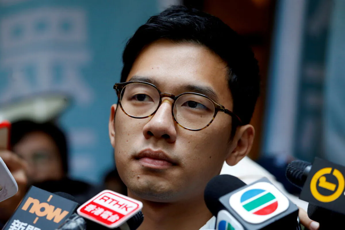 Pro-democracy activist Nathan Law is interviewed by journalists outside the Final Court of Appeal in Hong Kong on Oct. 24, 2017. (Bobby Yip/Reuters)