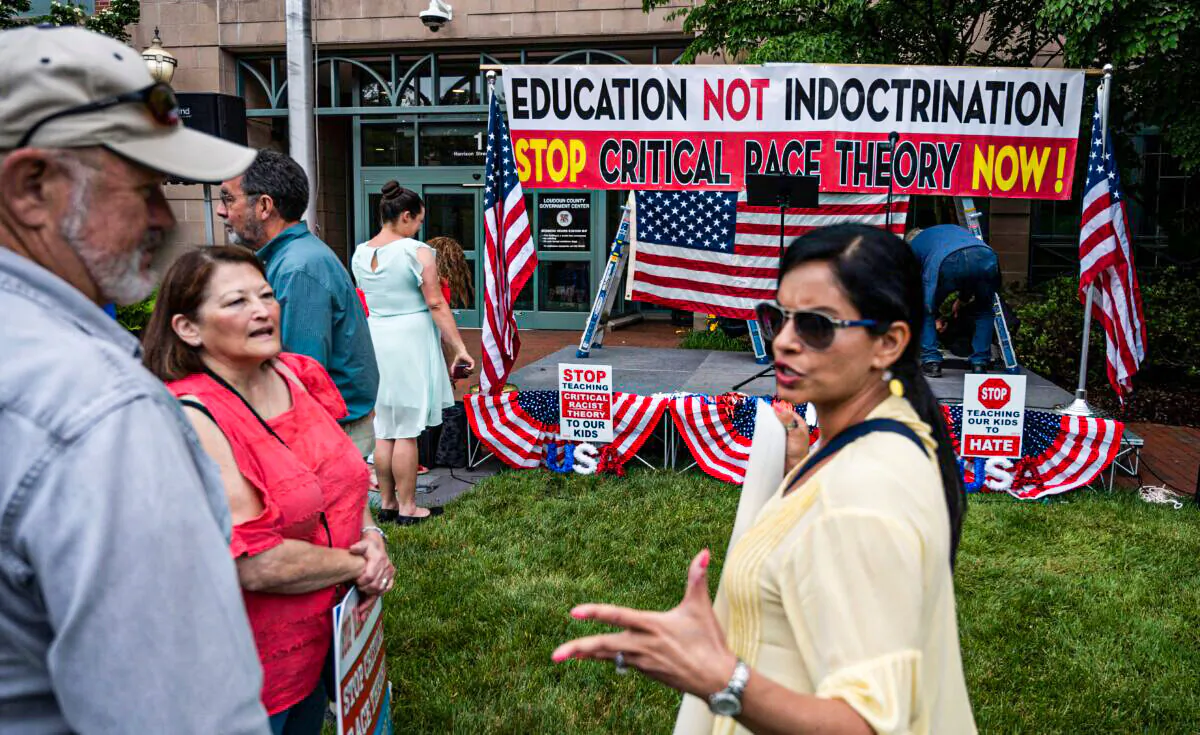 People talk before the start of a rally against "critical race theory" being taught in schools at the Loudoun County Government center in Leesburg, Virginia on June 12, 2021. (Photo by Andrew Caballero-Reynolds/AFP via Getty Images)