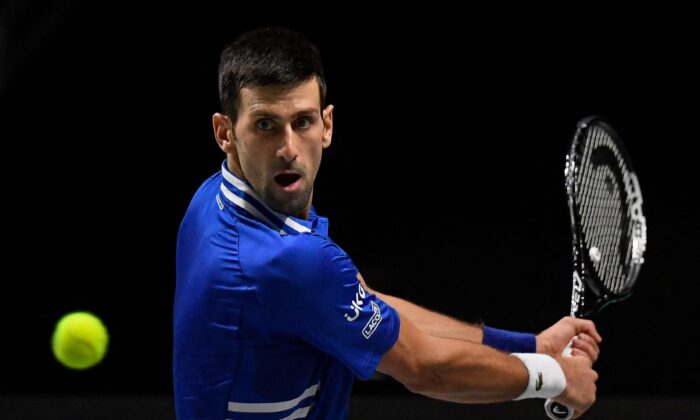 Serbia's Novak Djokovic returns the ball during the men's singles semifinal tennis match between Croatia and Serbia of the Davis Cup tennis tournament at the Madrid arena in Madrid, Spain, on Dec. 3, 2021. (Oscar  Del Pozo/AFP via Getty Images)