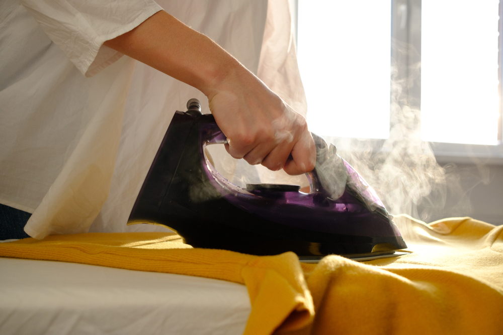 There's something soothing and instantly gratifying about a good iron with a heft of heat and steam gliding back and forth over wrinkled fabric. (sipcrew/Shutterstock)