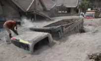 Indonesian Rescuers Dig Through Volcanic Ash After 14 Die