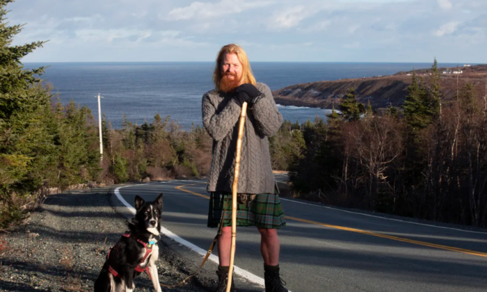 Michael Yellowlees of Scotland and his husky Luna complete a cross Canada journey near Cape Spear in Newfoundland and Labrador on Dec. 5.
(The Canadian Press/PAUL DALY)