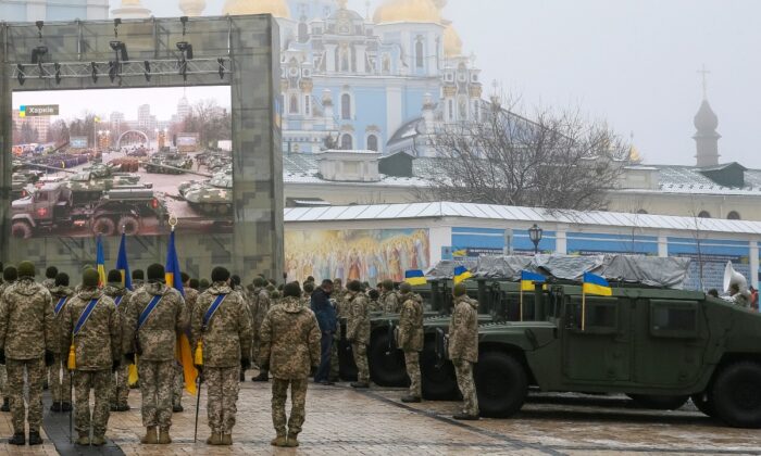 Ukrainian servicemen attend a rehearsal of an official ceremony to hand over tanks, armored personnel carriers and military vehicles to the Ukrainian Armed Forces as the country celebrates Army Day in Kyiv, Ukraine, on Dec. 6, 2021. (Gleb Garanich/Reuters)