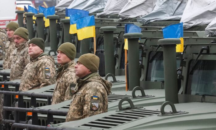 Ukrainian servicemen attend a rehearsal of an official ceremony to hand over tanks, armored personnel carriers, and military vehicles to the Ukrainian Armed Forces as the country celebrates Army Day in Kyiv, Ukraine, on Dec. 6, 2021. (Gleb Garanich/Reuters)
