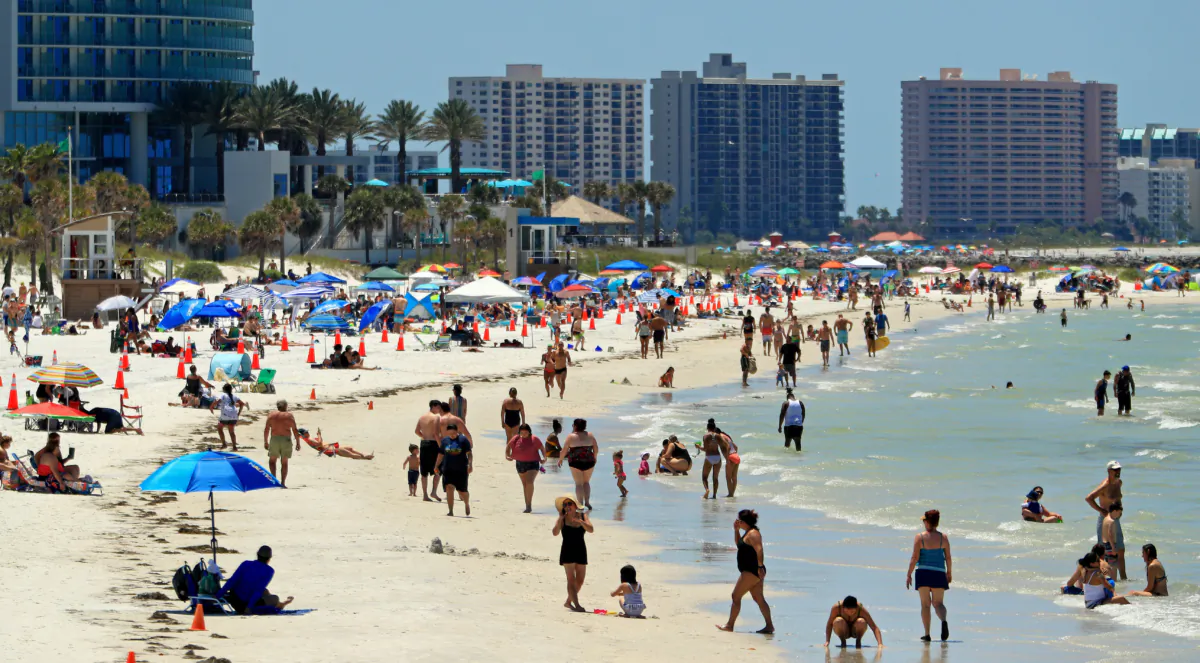 After being closed to visitors during Florida's early response to the COVID-19 pandemic, people visit Clearwater Beach after Gov. Ron DeSantis announces Florida beach re-openings on May 04, 2020. (Mike Ehrmann/Getty Images)