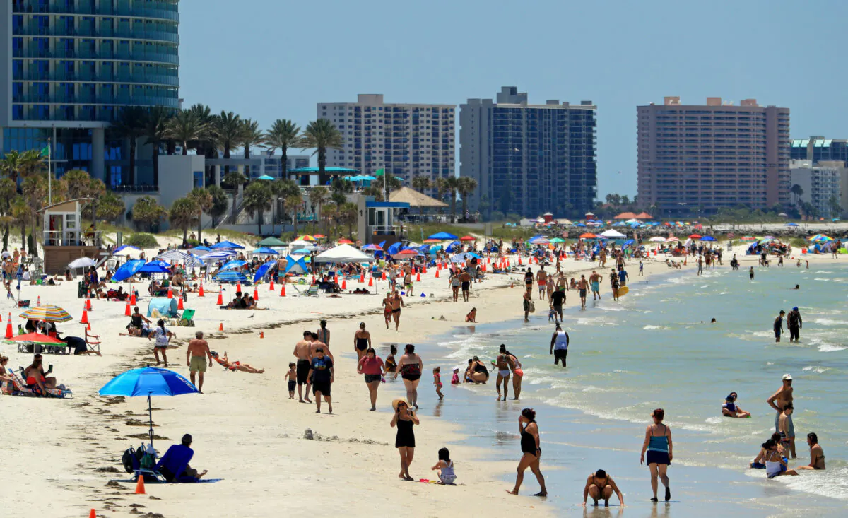 People visit Clearwater Beach after Governor Ron DeSantis opened the beaches at 7am, in Clearwater, Fla., on May 4, 2020. (Mike Ehrmann/Getty Images)