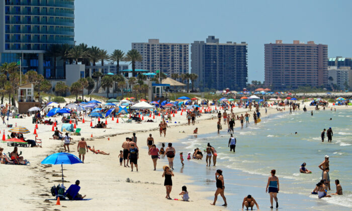 People visit Clearwater Beach after Governor Ron DeSantis opened the beaches at 7am, in Clearwater, Fla., on May 4, 2020. (Mike Ehrmann/Getty Images)