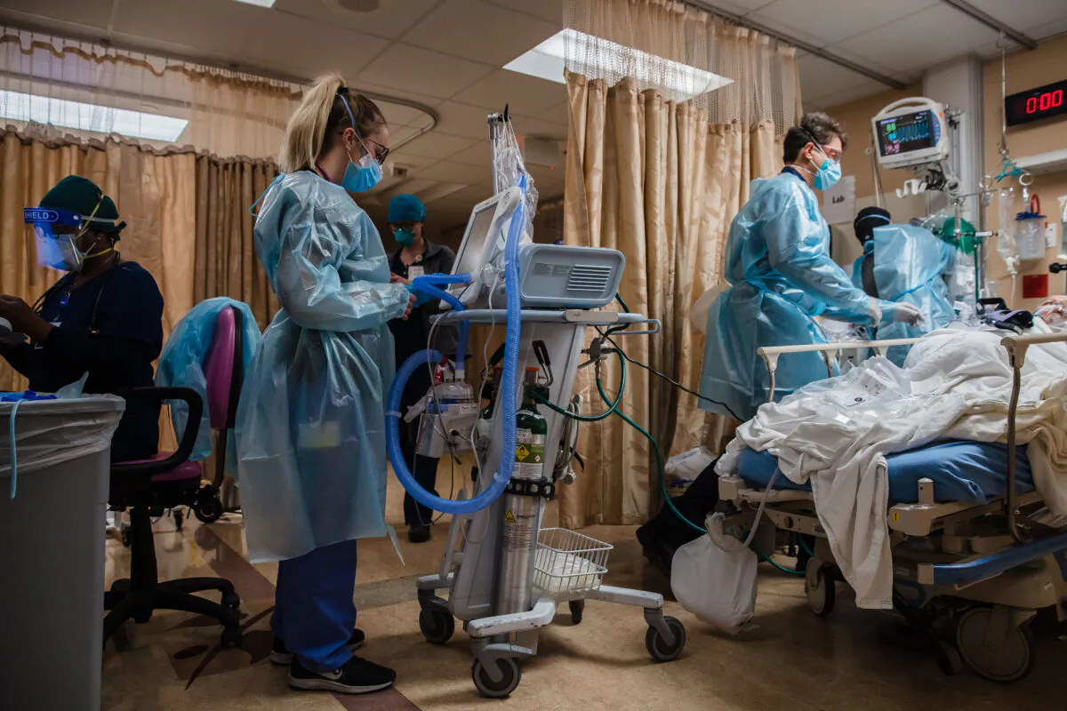 Health care workers are seen in a recent file photo (ARIANA DREHSLER/AFP via Getty Images)