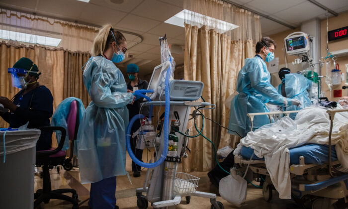 Healthcare workers are seen in a recent file photo (ARIANA DREHSLER/AFP via Getty Images)