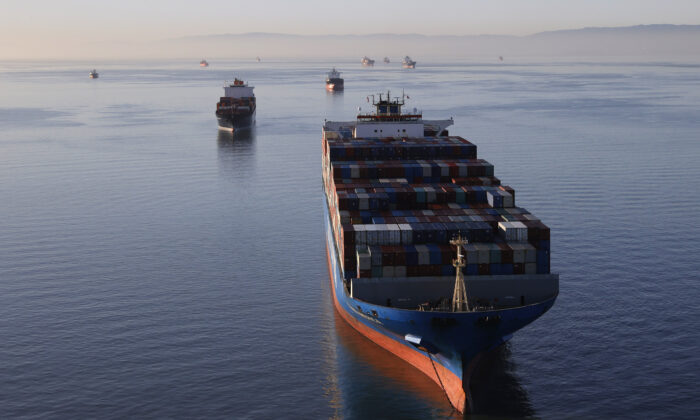 Container ships sit idle in the the San Francisco Bay just outside of the Port of Oakland on March 26, 2021. (Justin Sullivan/Getty Images)