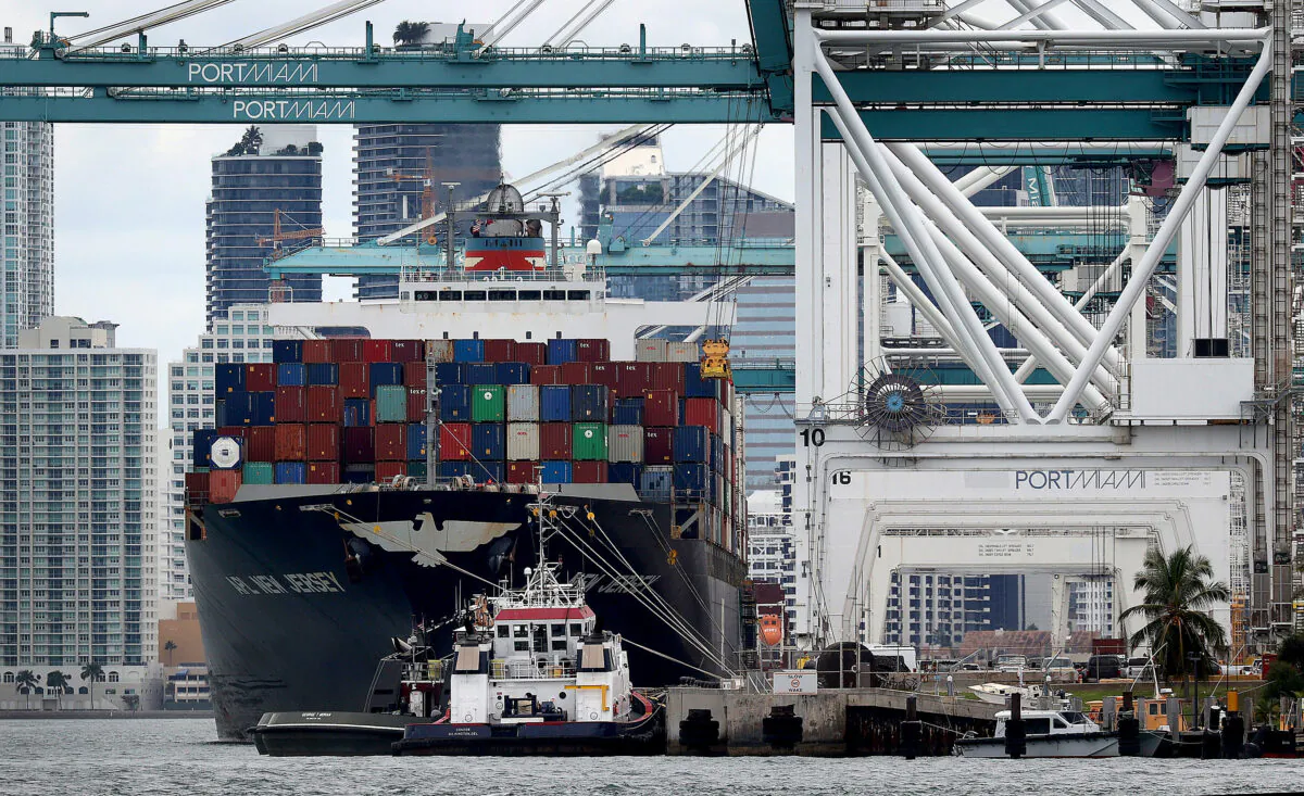 A cargo ship is offloaded at Port Miami, Fla., on Nov. 4, 2021. (Joe Raedle/Getty Images)