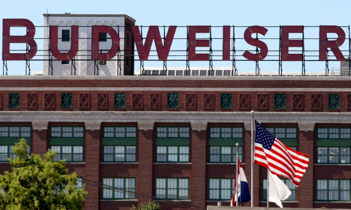 Flags fly in front of the packaging plant for Anheuser-Busch Cos. in St. Louis, Missouri on July 14, 2008. (Whitney Curtis/Getty Images)
