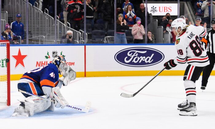 Chicago Blackhawks right wing Patrick Kane (88) scores the winning goal on New York Islanders goaltender Semyon Varlamov (40) during shootouts at UBS Arena in Elmont, N.Y., on Dec 5, 2021. (Dennis Schneidler/USA TODAY Sports via Field Level Media)