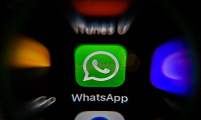 A smartphone displaying the Whatsapp logo on Nov. 10, 2021. (YURI KADOBNOV/AFP via Getty Images)