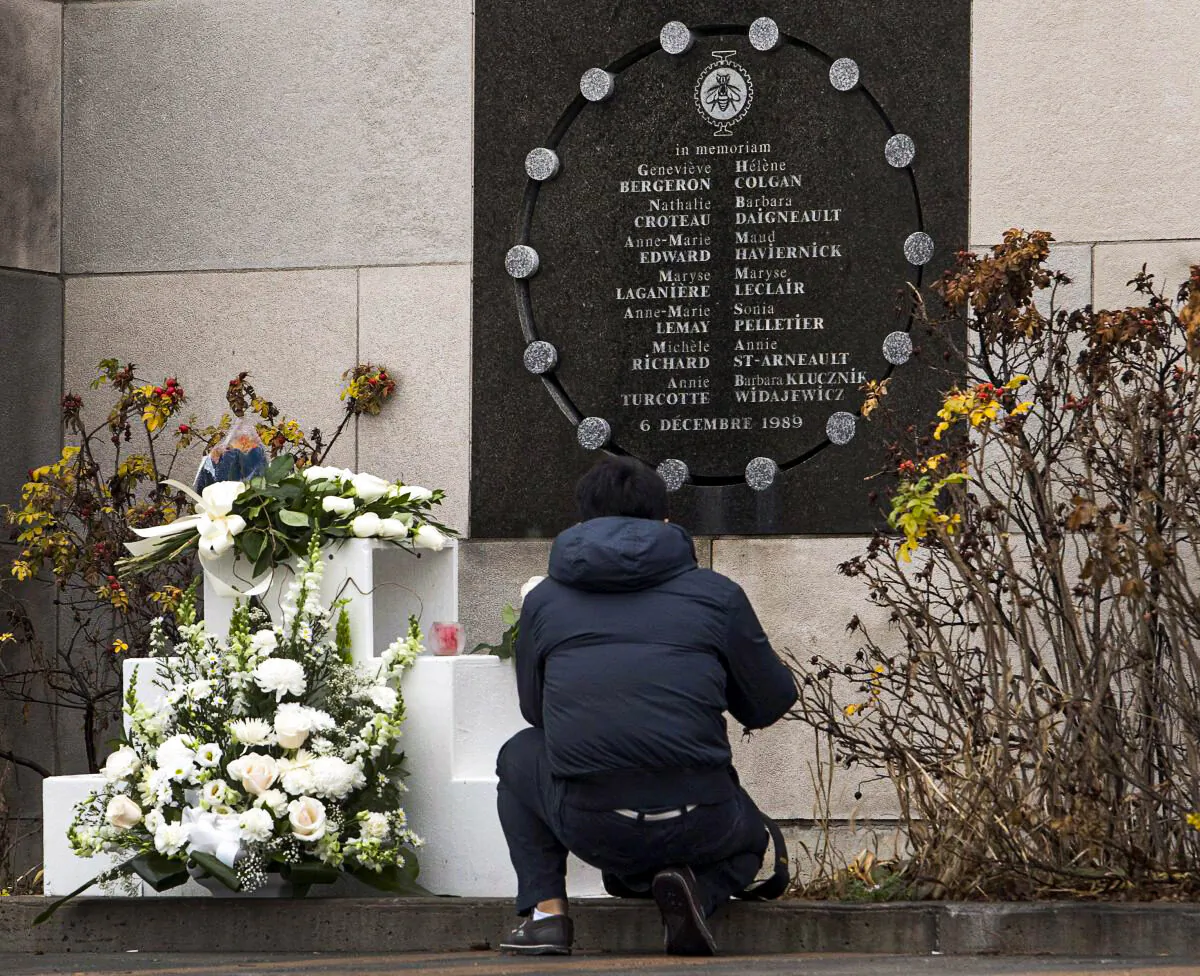 A man pays his respects at the memorial plaque at Ecole Polytechnique on Dec. 6, 2011, the 22nd anniversary of the Montreal massacre. The Dec. 6, 1989, massacre is still creating sharp political divisions on Parliament Hill over the nature of the crime and the proper response to it. (The Canadian Press/Ryan Remiorz)