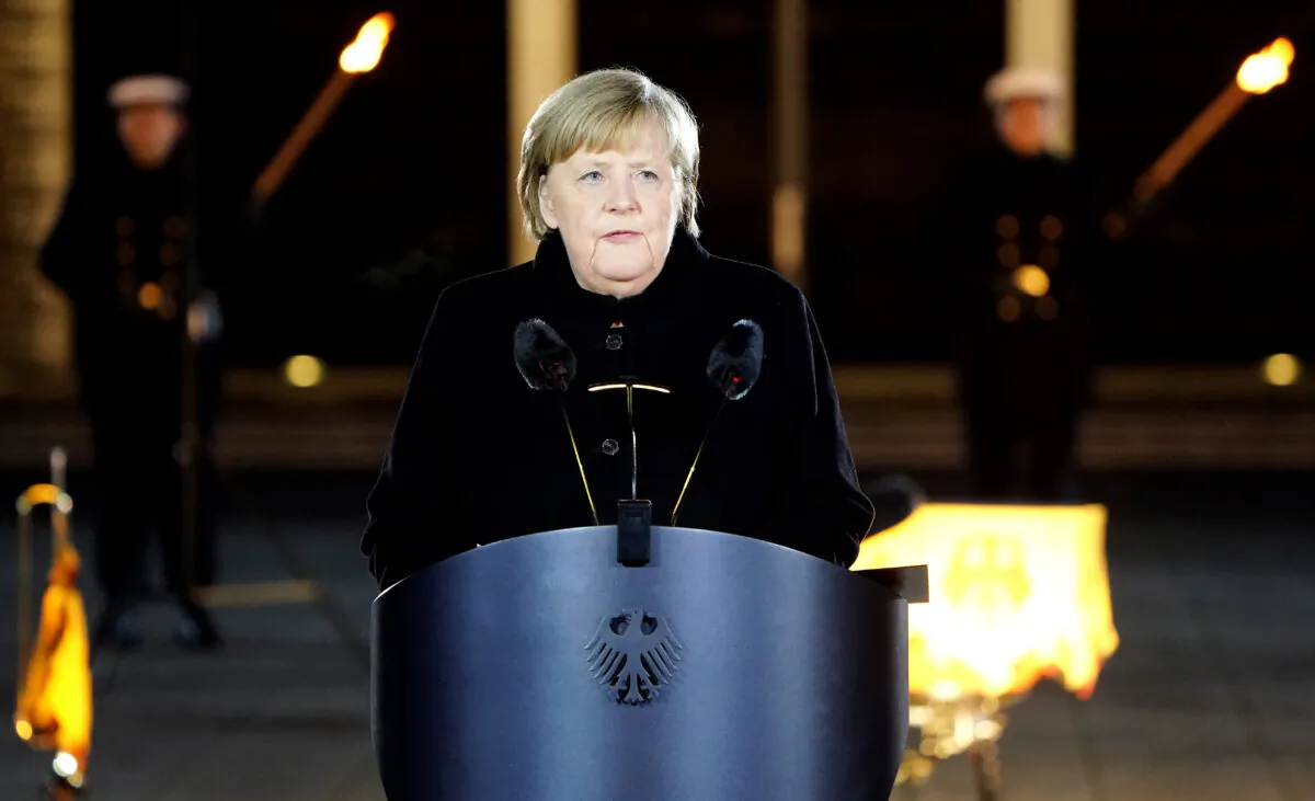 German Chancellor Angela Merkel delivers a speech as she attends her military tattoo ceremony in Berlin, on Dec. 2, 2021. (Friedemann Vogel/Pool/Getty Images)