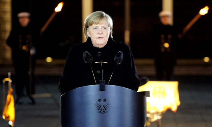 German Chancellor Angela Merkel delivers a speech as she attends her military tattoo ceremony in Berlin, on Dec. 2, 2021. (Friedemann Vogel/Pool/Getty Images)