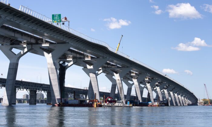 The new $4.2 billion Samuel de Champlain bridge in Montreal, with the old bridge in the background, on June 17, 2019. (The Canadian Press/Paul Chiasson)