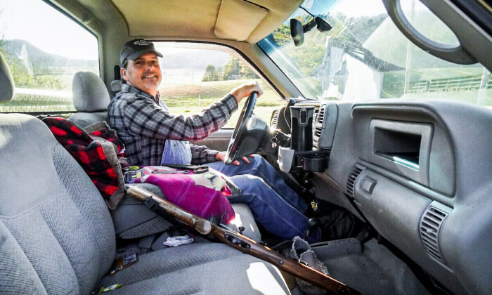 Farmer Mike Moyers sits in a truck with his tools at Valley Dream Farm near Knoxville, Tenn., on Dec. 2, 2021. (Jackson Elliott/The Epoch Times)