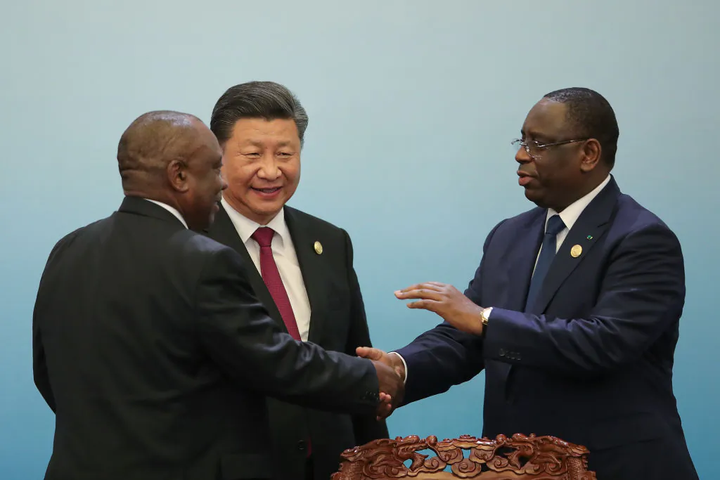 South African President Cyril Ramaphosa (L) shakes hands with Senegalese President Macky Sall (R) with Chinese Leader Xi Jingping during 2018 Beijing Summit Of The Forum On China-Africa Cooperation Joint Press Conference at the Great Hall of the People at The Great Hall Of The People in Beijing, China, on Sept. 4, 2018. (Lintao Zhang/Pool/Getty Images)