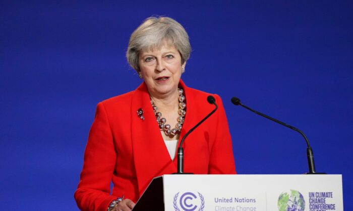 Theresa May speaks as ministers, businesses, and activists discuss rainforests on day seven of COP26 at SECC in Glasgow, Scotland, on Nov. 6, 2021. (Ian Forsyth/Getty Images)