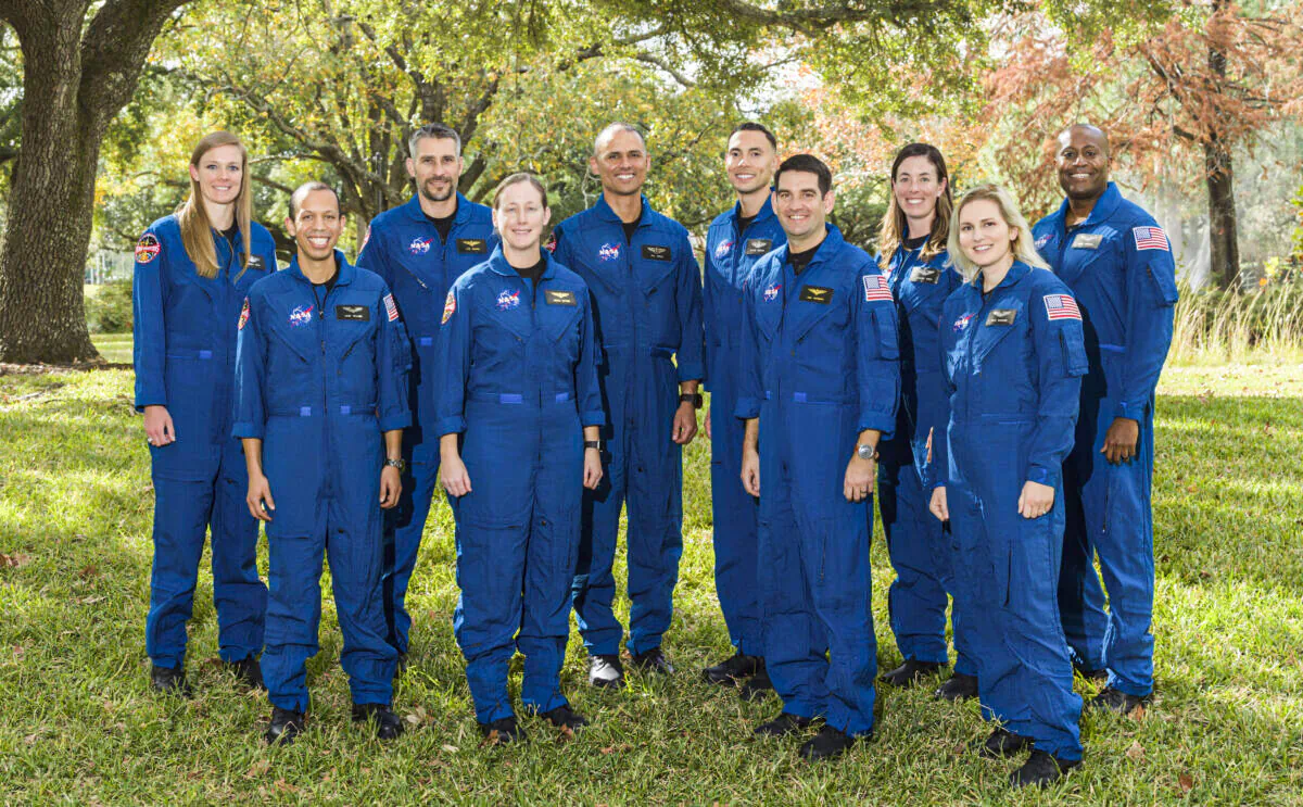 This photo provided by NASA shows its 2021 astronaut candidate class, announced on Dec. 6, 2021. The 10 candidates stand for a photo at the Johnson Space Center in Houston on Dec. 3, 2021. From left are U.S. Air Force Maj. Nichole Ayers, Christopher Williams, U.S. Marine Corps Maj. (retired.) Luke Delaney, U.S. Navy Lt. Cmdr. Jessica Wittner, U.S. Air Force Lt. Col. Anil Menon, U.S. Air Force Maj. Marcos Berríos, U.S. Navy Cmdr. Jack Hathaway, Christina Birch, U.S. Navy Lt. Deniz Burnham, and Andre Douglas. (Robert Markowitz/NASA via AP)