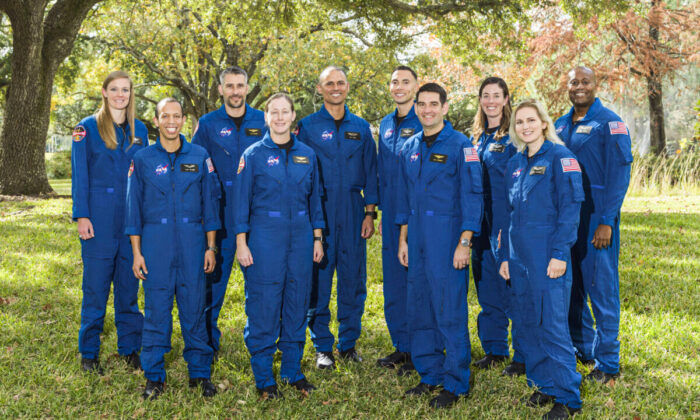 This photo provided by NASA shows its 2021 astronaut candidate class, announced on Dec. 6, 2021. The 10 candidates stand for a photo at the Johnson Space Center in Houston on Dec. 3, 2021. From left are U.S. Air Force Maj. Nichole Ayers, Christopher Williams, U.S. Marine Corps Maj. (retired.) Luke Delaney, U.S. Navy Lt. Cmdr. Jessica Wittner, U.S. Air Force Lt. Col. Anil Menon, U.S. Air Force Maj. Marcos Berríos, U.S. Navy Cmdr. Jack Hathaway, Christina Birch, U.S. Navy Lt. Deniz Burnham, and Andre Douglas. (Robert Markowitz/NASA via AP)