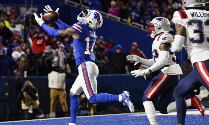 Buffalo Bills wide receiver Stefon Diggs (14) can't hang onto a pass in the end zone with New England Patriots free safety Devin McCourty (32) defending during the second half of an NFL football game in Orchard Park, N.Y., on Dec. 6, 2021. (Adrian Kraus/AP Photo)