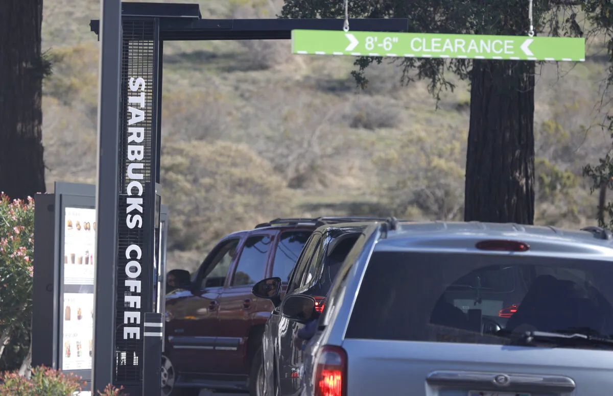 Customers line up in a drive thru at a Starbucks store in Novato, Calif., on Oct. 29, 2021. (Justin Sullivan/Getty Images)