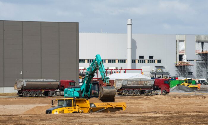 An excavator operates as work continues on Tesla's European "Gigafactory" in Gruenheide, near Berlin, on April 8, 2021.  (John Macdougall/AFP via Getty Images)