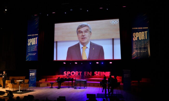 President of the International Olympic Committee Thomas Bach attends via by video call the 1st edition of "Sport en Seine" Festival at La Maison de la Radio in Paris, on Oct. 28, 2021. (Julien De Rosa/AFP via Getty Images)