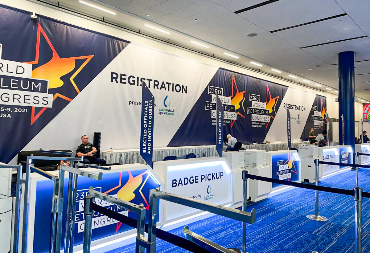 A view of a quiet registration desk for the World Petroleum Congress in Houston on Dec. 5, 2021. (Sabrina Valle/Reuters)