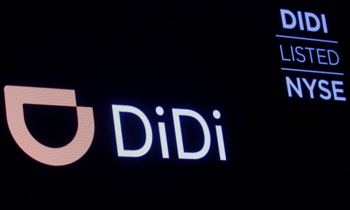 A screen displays trading information for Didi Global on the floor of the New York Stock Exchange (NYSE) in New York City, on Dec. 3, 2021. The ride-hailing giant is delisting from NYSE as it faces mounting pressure from Chinese regulators over data security concerns. (Brendan McDermid/Reuters)