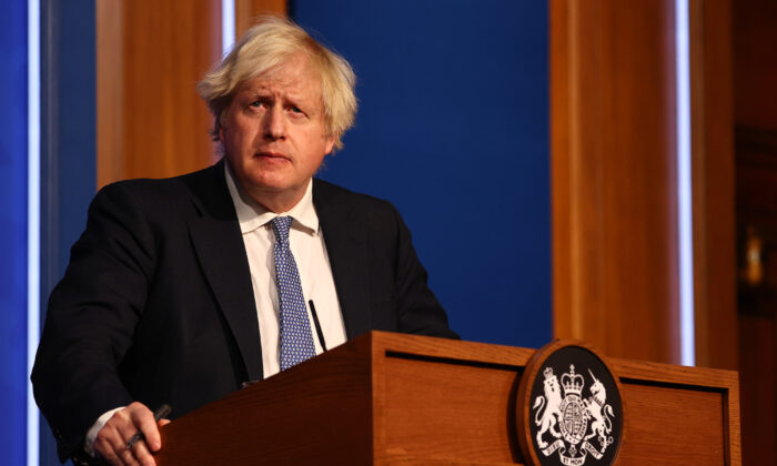 British Prime Minister Boris Johnson gives a press conference at 10 Downing Street on Dec. 8, 2021. (Adrian Dennis-WPA Pool/Getty Images)
