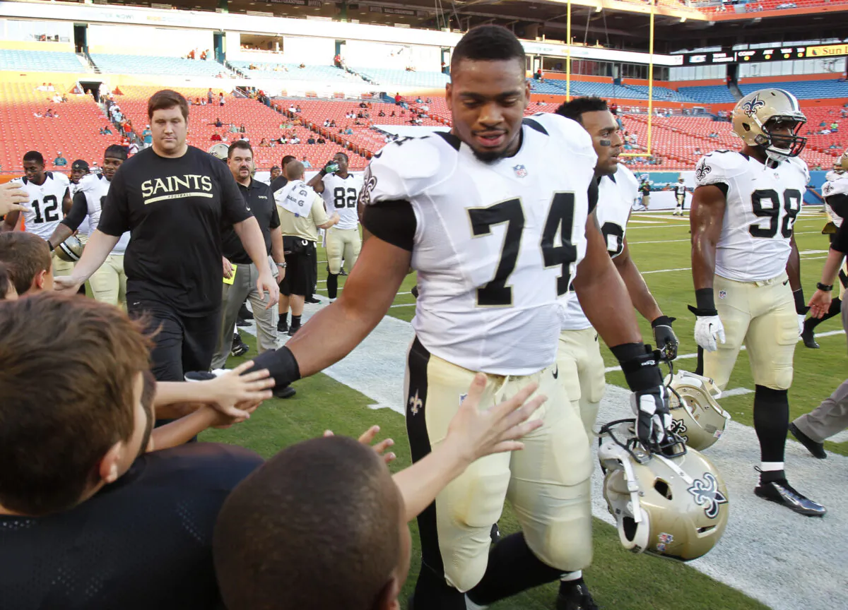 New Orleans Saints defensive end Glenn Foster Jr. (74) greets fans in Miami Gardens, Fla., on Aug. 29, 2013. (Wilfredo Lee/AP Photo)