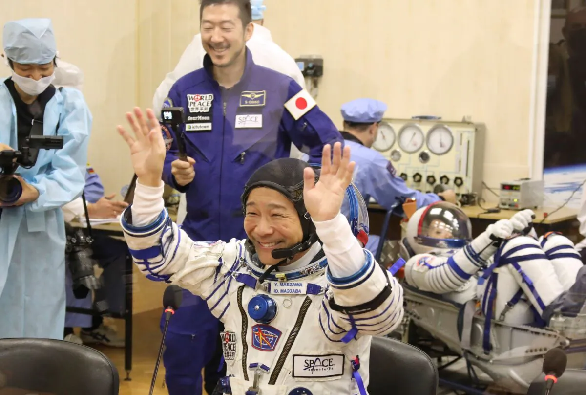 Yusaku Maezawa of Japan, member of the main crew of the new Soyuz mission to the International Space Station (ISS), gestures prior the launch at the Russian leased Baikonur cosmodrome, Kazakhstan, on Dec. 8, 2021. (Pavel Kassin/Roscosmos Space Agency via AP)