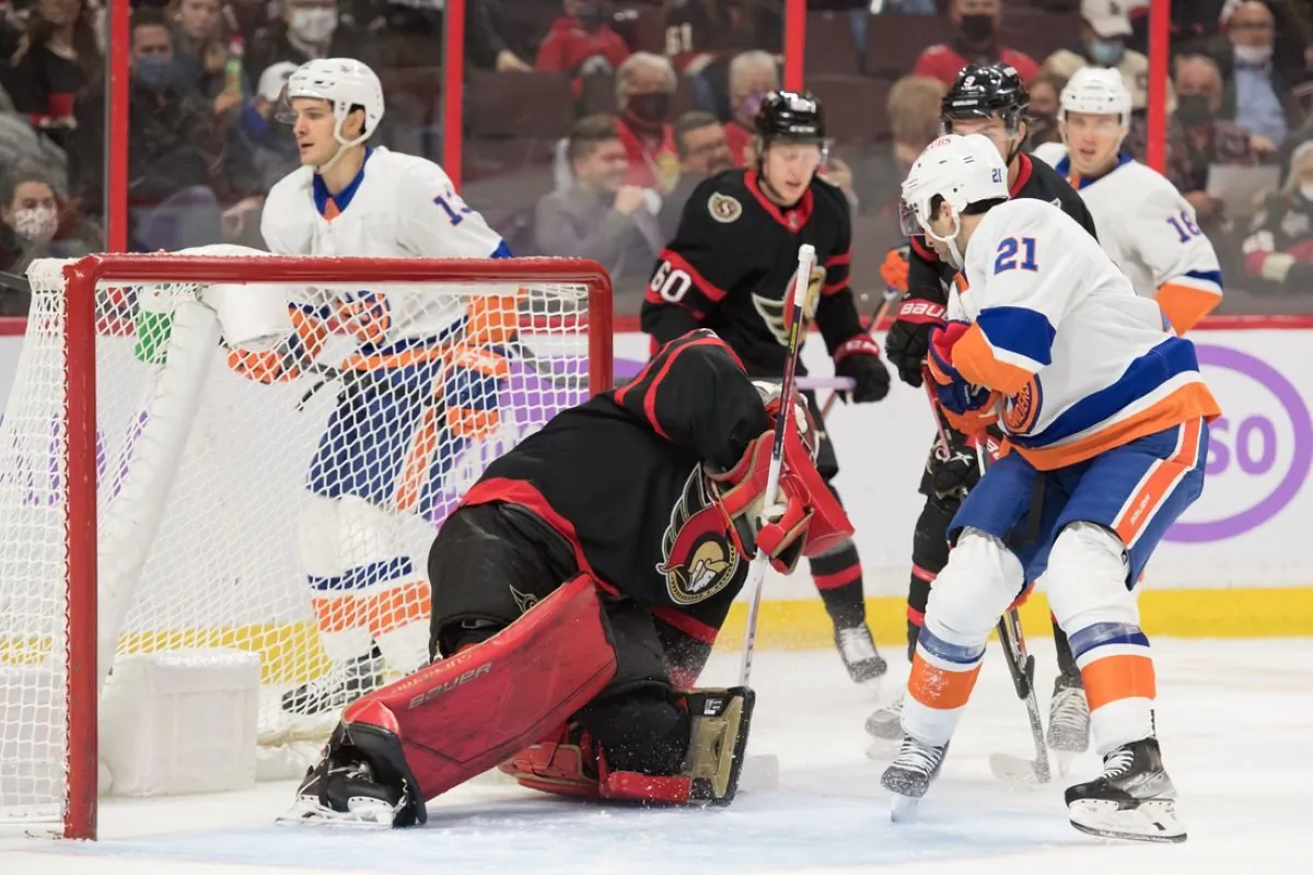 Ottawa Senators goalie Filip Gustavsson (32) makes a save in front of New York Islanders center Kyle Palmieri (21) in the first period at the Canadian Tire Centre in Ottawa, Ontario, CAN, on Dec. 7, 2021.
(Marc DesRosiers/USA TODAY Sports via Field Level Media)
