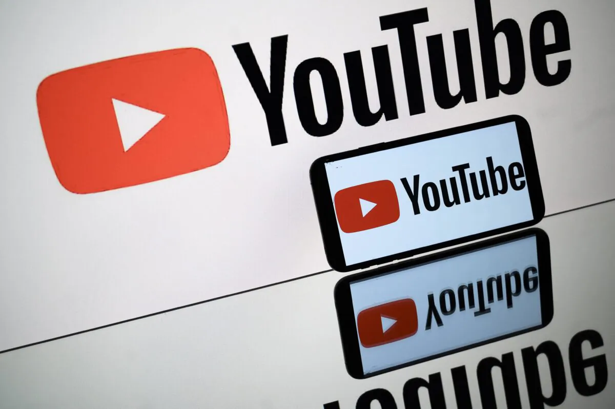 The logo of Youtube is displayed by a tablet and a smartphone during Toulouse shows, on Oct. 5, 2021. (Lionel Bonaventure/AFP via Getty Images)