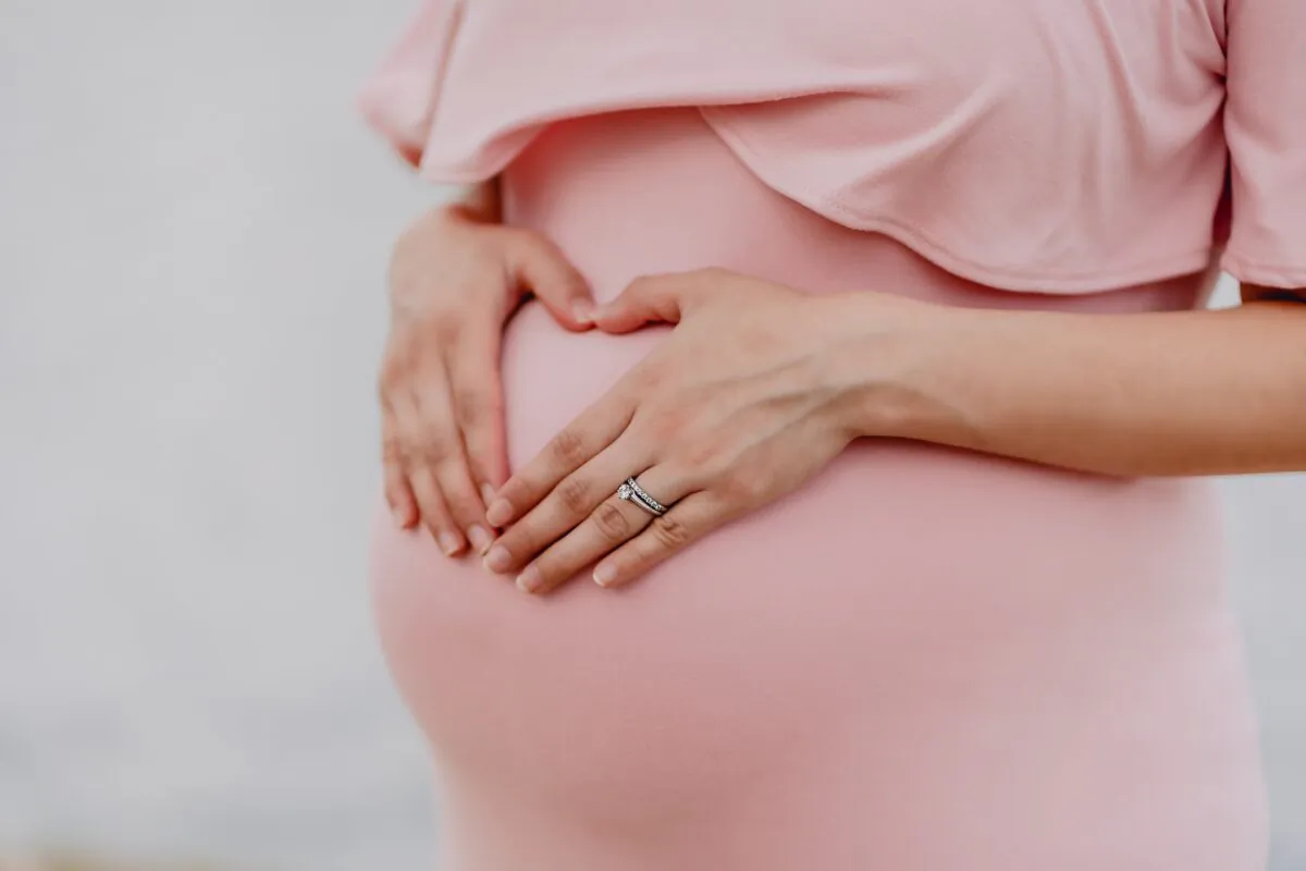 Stock image showing a pregnant woman. (Juan Encalada/Unsplash)