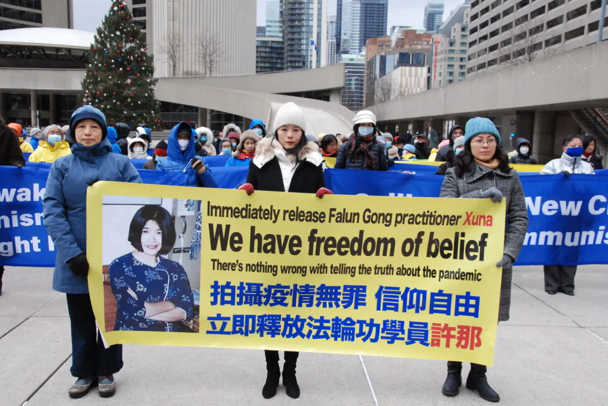 Falun Gong adherents hold a rally to call on Prime Minister Justin Trudeau to demand that the Chinese Communist Party end its long-running persecution campaign of adherents in China during the upcoming Summit for Democracy, at Toronto City Hall on Dec. 7, 2021. (Michelle Hu/The Epoch Times)